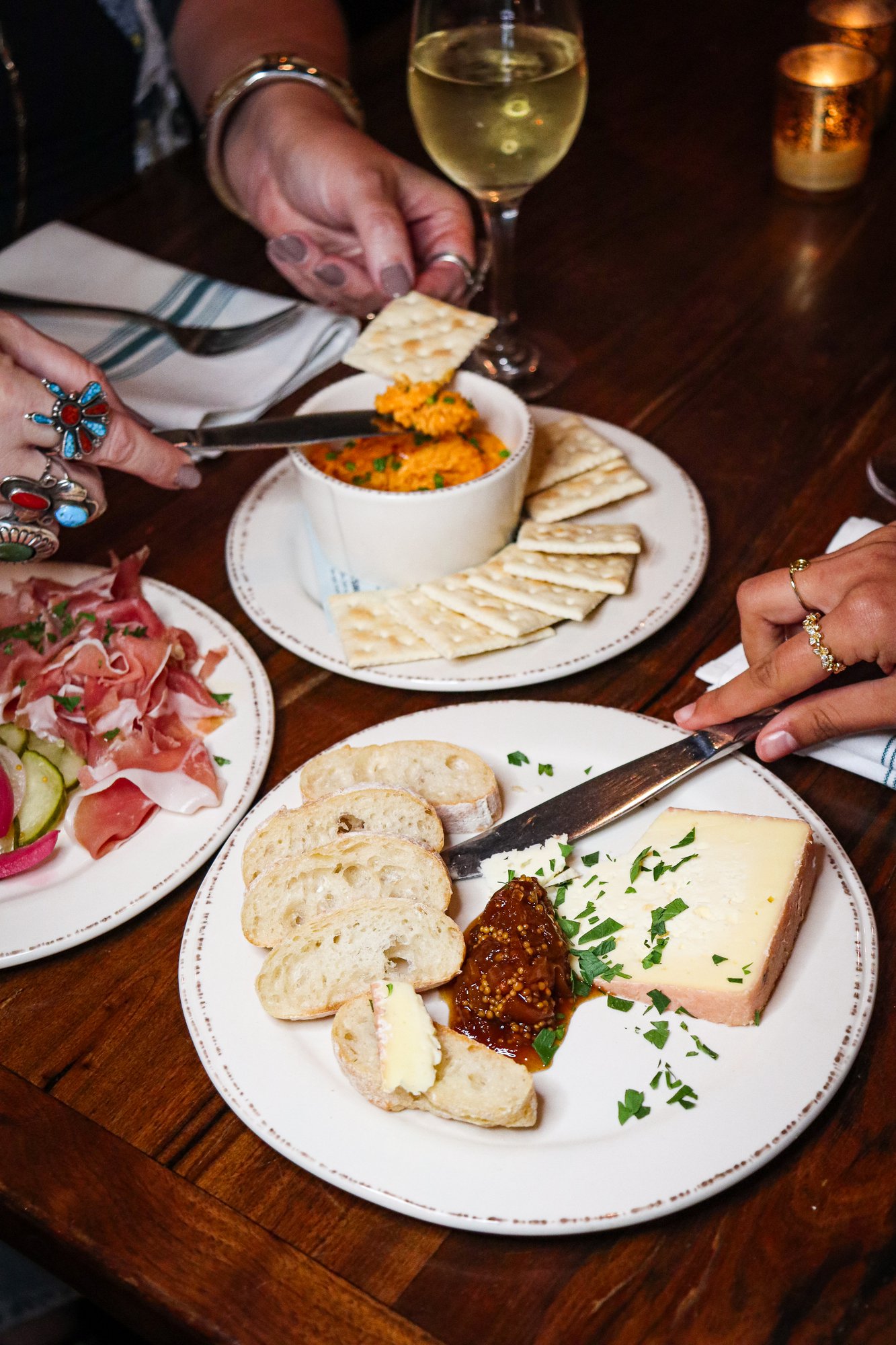 A cheese and charcuterie board with wine at Slow Hand